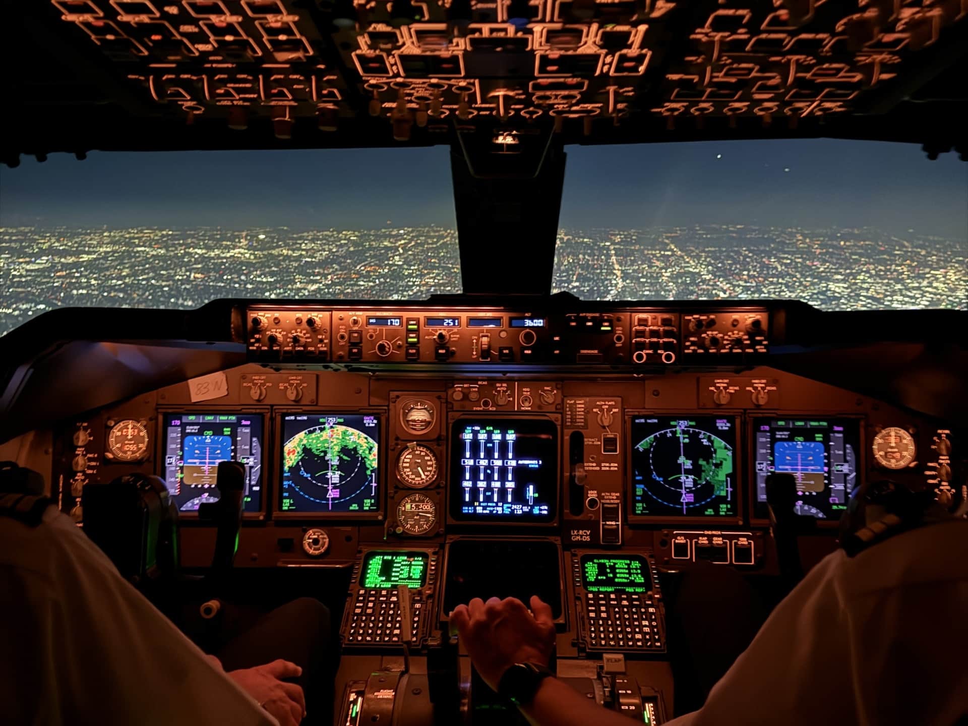 Captain Joe in airplane cockpit at sunset - professional airline pilot with 17+ years experience